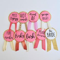 six pink and gold hair clips with different sayings on them, one says bridal