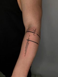 a person with a cross tattoo on their arm