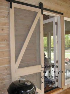 an open sliding barn door with the words love the barn's style door into kitchen