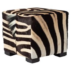 a zebra print stool with black legs