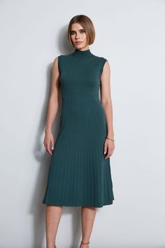 Our Mock Neck Midi Dress is an elevated take on the knit dress trend. Featuring a Fit & Flare silhouette & pointelle rib stitch, this ultra-versatile dress can be easily dressed up with heels or down with sandals. Our Knit Midi Dress is a seasonless must have! Elie Tahari Exclusive Stretch Rib Knit Fit & Flare Midi Dress 67% Rayon, 28% Nylon, 5% Elastane Runs True to Size Model is wearing size 2 Dry Clean Only Imported Style #: E7522604 Elegant Green Knit Midi Dress, Chic Green Knit Midi Dress, Knee-length Ribbed Knit Midi Dress, Chic Knit Midi-length Mini Dress, Stretch Knit Midi Dress Knee-length, Mock Neck Midi Dress, Flare Midi Dress, Rib Stitch, Mock Neck Dress