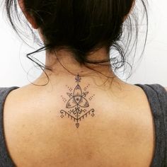 a woman with a tattoo on her back