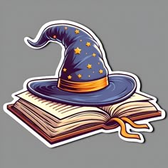 an open book with a wizard's hat sitting on top of it and stars