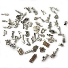 PRICES MAY VARY. What You'll Get: 52 pieces of Music Charms; assorted music theme pendant charms for jewelry making and perfect gift ideas for friends and family. Reliable Quality: these music notes charms are made of study alloy, lead and nickel free, sturdy and safe to use, not easy to break, can be used for a long time Music Charm Collection: our metal charms feature in various styles: music notes, musical instruments such as guitar, piano, sax, harp, trumpet and headset, tape, radio, etc. Wi Bracelet Keychain Diy, Music Pendant, Music Keychain, Music Bracelet, Instrument Music, Bracelet Keychain, Charms For Bracelets, Charm Collection, Charms For Jewelry Making