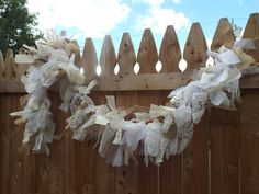 a wooden fence that has some paper on it