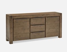 the sideboard is made from wood and has three drawers