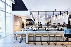 an empty restaurant with people sitting at the counter