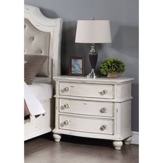 The Jaqueline Nightstand combines elegance and functionality with its gray linen and antique white finish. Made from a combination of wood, composite wood, upholstery, and resin, this nightstand is durable and long-lasting. It features KD legs and wooden bun legs for added stability. The peeling style design adds a touch of uniqueness to this piece. The nightstand also includes a metal side drawer glide, 2/3 extension, DT English front and back, and a felt-lined top drawer for storing and organi Lined Drawers, Wooden Nightstand, Bedroom Essentials, Acme Furniture, Mattress Sets, Bedroom Night Stands, Furniture Deals, Night Stand, Top Drawer