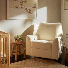 a baby's room with a rocking chair and crib