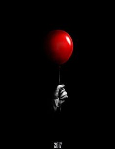 a person holding a red balloon in their hand with the words vos on it