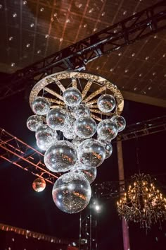 an elaborate chandelier hanging from the ceiling in a room with lights and chandeliers