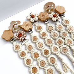 a bunch of wooden buttons sitting on top of a white table next to each other