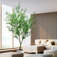 a living room filled with furniture and a tree in the middle of it's center