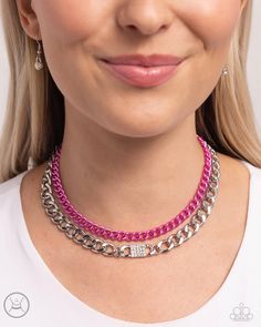 Dipped in an electric pink hue, a classic chain joins a dramatic silver curb chain, layering below the collar in a fierce fashion. White rhinestones adorn the surface of a square pendant that is centered in the glistening silver curb chain, adding a timeless shimmer to the show-stopping piece. Features an adjustable clasp closure. Sold as one individual choker necklace. Includes one pair of matching earrings. Chic Pink Necklace With Adjustable Chain, Pink Chain Link Necklace With Adjustable Chain, Square Rhinestone Necklace, Adjustable Pink Faceted Necklace, Paparazzi Short Copper Double Chain Necklace, Paparazzi Jewelry Pearl Necklace, Square Pendant, White Rhinestone, Paparazzi Accessories