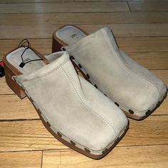 These Are Zara Beige Suede Square Toe Wooden Heel Clogs Size 39 Brand New With Tags Minor Scuffs From Trying On In Store But Absolutely Unworn With Tags Attached. Need To Make Room For New Stuff Bought These On A Whim. Casual Suede Mules With Block Heel, Casual Mules With Wooden Heel, Beige Suede Casual Clogs, Casual Beige Suede Clogs, Casual Suede Mules With Stacked Heel, Casual Beige Platform Mules, Casual Beige Block Heel Mules, Casual Suede Clogs With Block Heel, Beige Suede Closed Toe Clogs