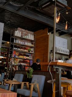 people are sitting at tables in a restaurant