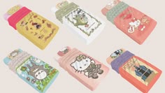 the hello kitty towels are lined up in different colors and designs, including one with an animal on it