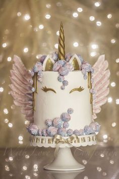 a birthday card with a cake decorated like a unicorn and the words, happy birthday giveaway