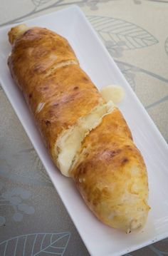 a piece of bread on a white plate