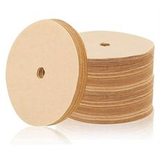 a stack of wooden discs on a white background