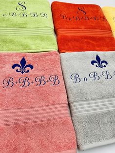 four towels with the names of different colors and designs are lined up in a row