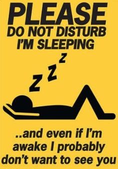 a sign that says, please do not disturb i'm sleeping and even if i'm awake i probably don't want to see you