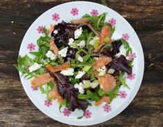 a white plate topped with lots of salad