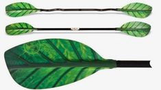 three different types of paddles with green leaves on the sides and black handles,