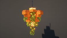 a pixellated light hanging from a chain