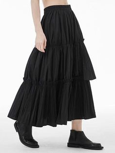 Black Pleated Hem Skirted Bottoms, Black Skirted Bottoms With Pleated Hem, Casual Black Bottoms With Pleated Hem, Chic Bottoms With Tiered Skirt And Folds, Black Voluminous Maxi Skirt With Ruffles, Black Long Skirt With Ruffles, Black Tiered Ruffled Maxi Skirt, Black Tiered Ruffled Skirt, Black Midi Skirt With Ruffles