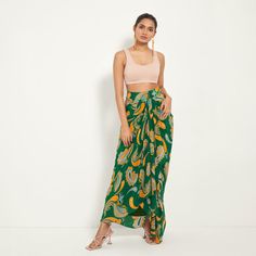 Green Paisley Draped Skirt | Style Junkiie | Wolf & Badger Summer Draped Wrap Skirt, Fitted Draped Bottoms For Summer, Asymmetrical Green Maxi Skirt For Beach, Green Fitted Asymmetrical Draped Skirt, Summer Draped Flowy Skirt, Summer Flowy Draped Wrap Skirt, Chic Green Draped Skirt For Summer, Flowy Draped Summer Wrap Skirt, Flowy Draped Wrap Skirt For Summer