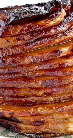 a stack of bacon sitting on top of a glass plate