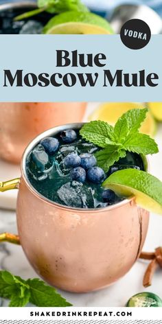 two moscow mules with blueberries and mint garnish