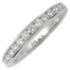 a white gold wedding ring with channeled diamonds