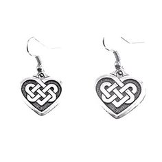 two heart shaped earrings with an intertwined knot in the shape of a heart on white background