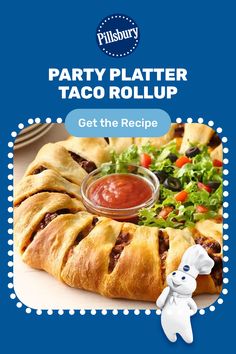 an advertisement for a party platter taco roll up with a stuffed animal next to it