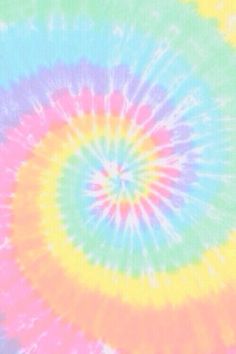 a multicolored tie - dyed background with an abstract design in the middle and center