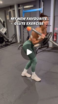 a woman holding a barbell in a gym with the words, my new favorite glute exercise