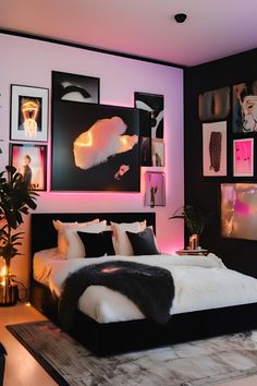 a black and white bedroom with pictures on the wall