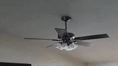 a ceiling fan is hanging from the ceiling