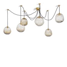 five glass globes hanging from the ceiling, with one light on each side and four lights in the middle