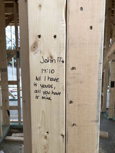 a piece of wood with writing on it