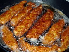 fried food being cooked in a frying pan