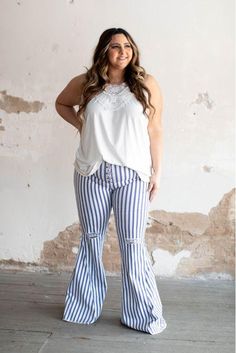 Denim stripe high waisted Lace Up Flare Jeans. Can be paired with your favorite tops! This non stretchable denim can be a perfect wear for all occasions. Fits True to size Trendy High-waisted Bottoms With Vertical Stripes, White High Waist Bottoms With Vertical Stripes, High Waist White Bottoms With Vertical Stripes, Spring Cotton Bottoms With Striped Hem, Stretch Striped Cotton Pants, Chic Striped Cotton Pants, Casual Spring Bottoms With Vertical Stripes, Chic Stretch Bottoms With Vertical Stripes, Casual High Waist Vertical Stripes Pants