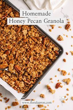 homemade honey pecan granola in a baking pan on a white table with text overlay