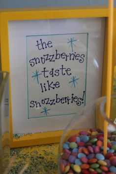 there is a sign that says the snuzzberries taste like snuzzles