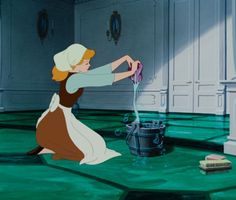 an animated image of a woman holding a crystal ball in her hand while sitting on the floor