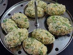 several crab cakes in a metal pan on a table