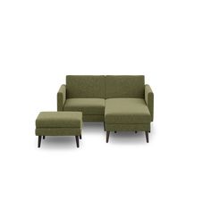 a green couch and ottoman sitting next to each other