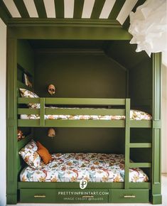 the bunk bed is built into the green painted wall in this kids's room